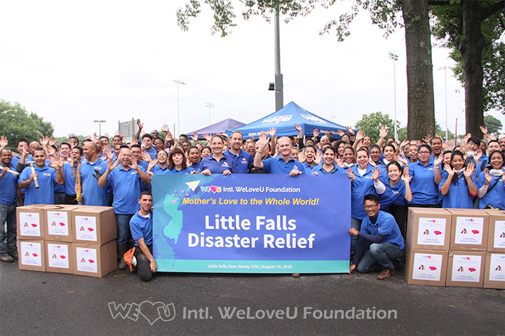 WeLoveU volunteers take a group photo with Little Falls council members.