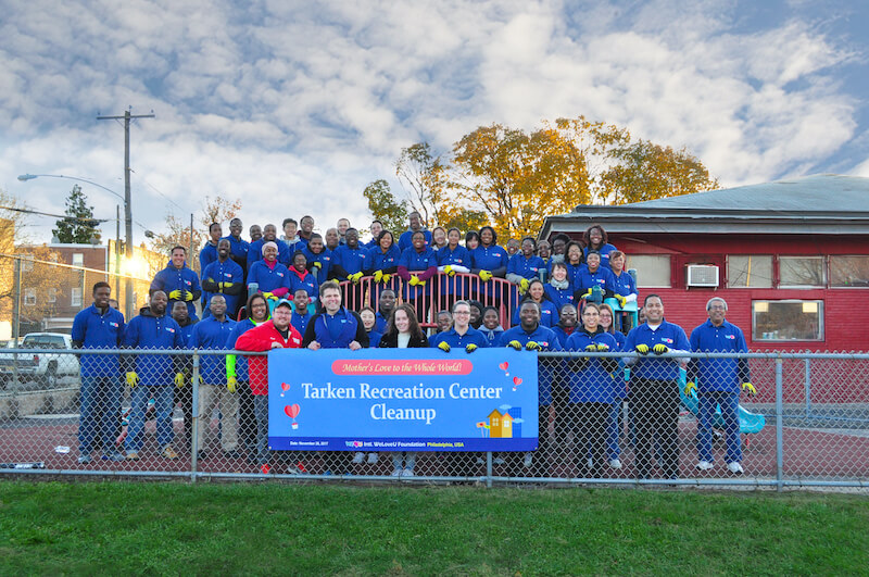 State Rep Solomon takes group photo with WeLoveU volunteers after a park cleanup.