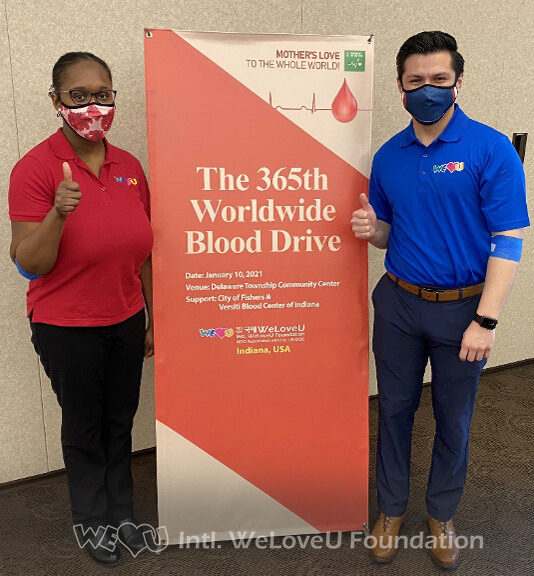 Two donors give a thumbs up after donating blood with Veristi Blood Center