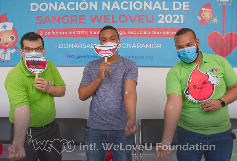 Three blood donors smile after donating blood