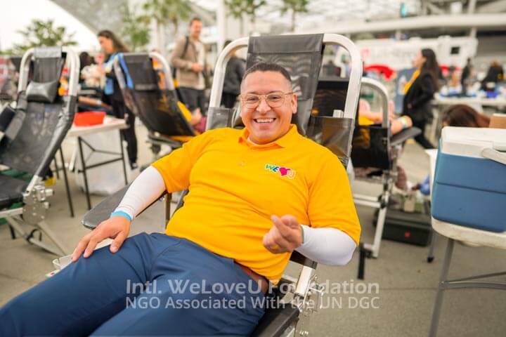 WeLoveU volunteer sitting at the blood donation area