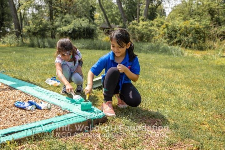 Children painting the playground