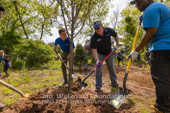 Commissioner Paul Drake planting a tree