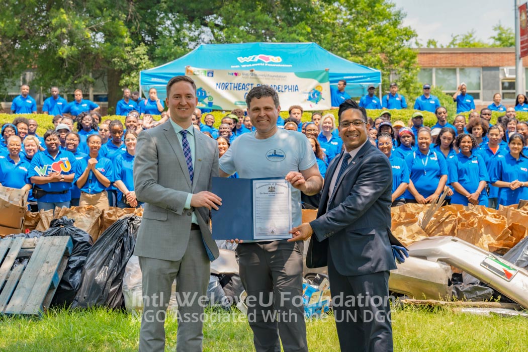 State Rep Solomon holding Citation with WeLoveU representatives