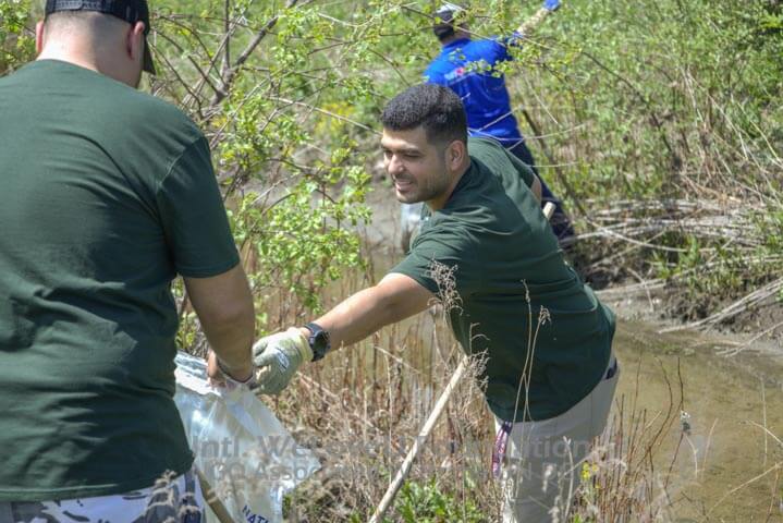 Antunes employees working together to clean
