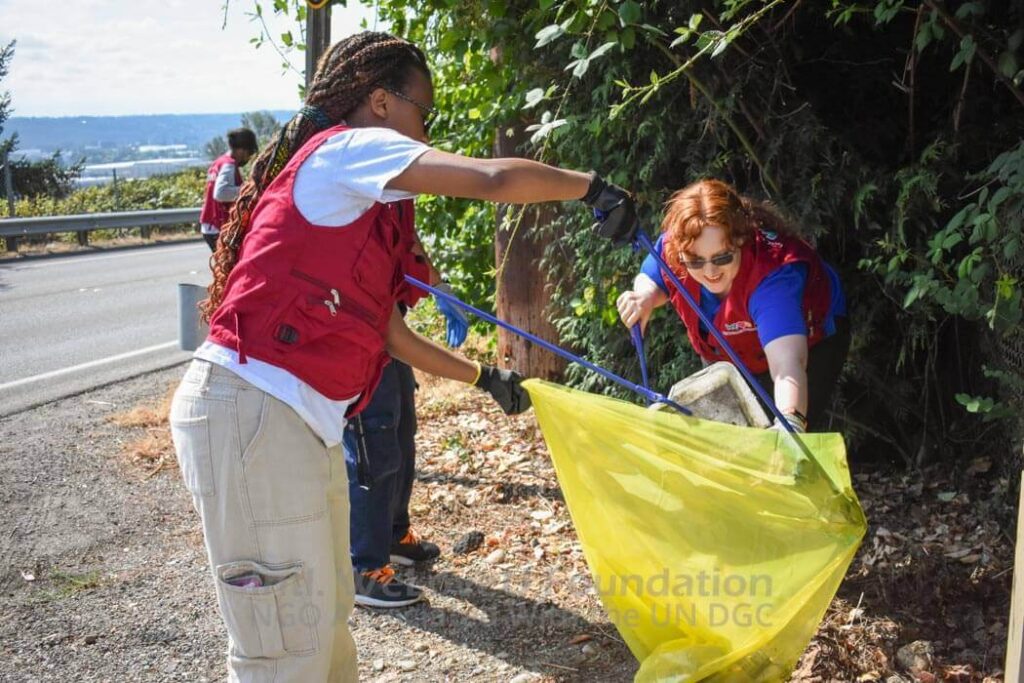 Volunteers working together to clean Military Road